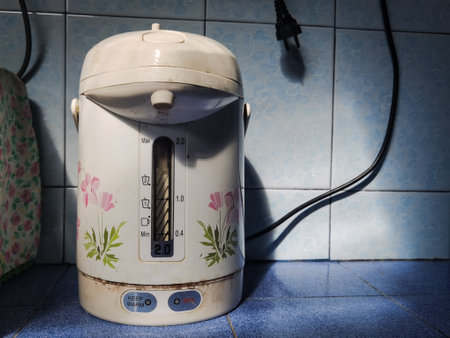 electric hot water pot on the kitchen wallの写真素材