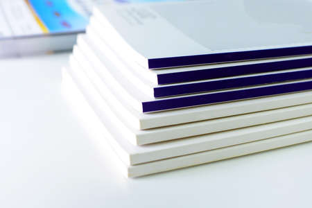 pile of annual report books on white isolated in the university libraryの写真素材