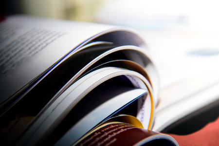 Open magazine on the table in the university library.の写真素材