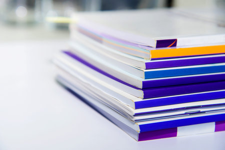 Stack of documents on the desk in office. Selective focus.