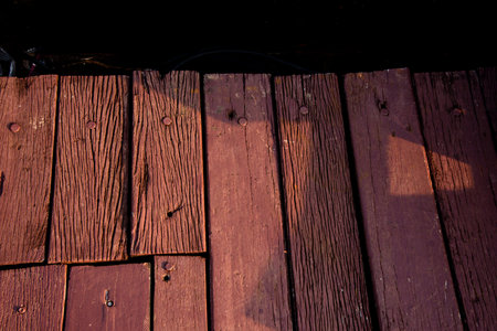 Wooden deck in the morning light with copy space for text.