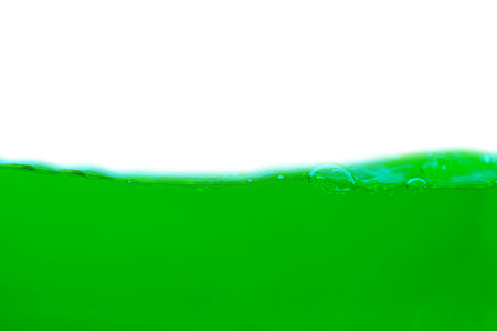 Green water splash isolated on white background with space for your text.の写真素材
