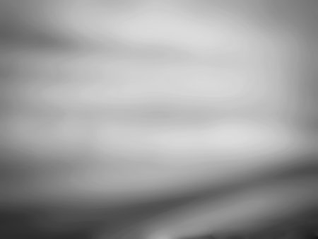 black and white abstract background with blurred lights and bokeh effectの写真素材