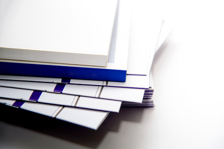 Stack of white books on a table. Back to school concept.の写真素材