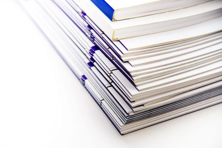 Stack of books isolated on white background. Shallow depth of field.