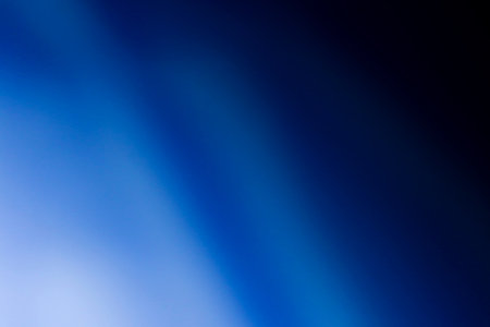 abstract blue background with bokeh defocused lights and shadowの写真素材