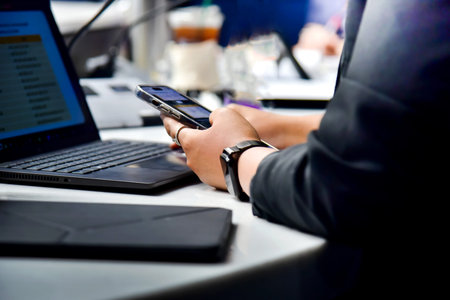 Businessman working with laptop and mobile phone in the office. Business concept.