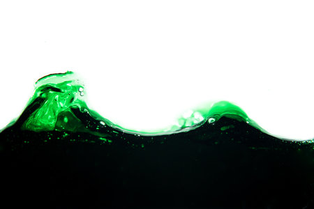 Water splash isolated on white background. Abstract background. Green liquid.の写真素材