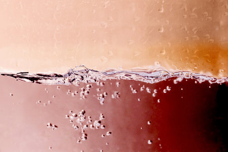 splash of cola in water with bubbles, close-upの写真素材