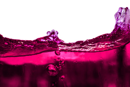 close up of pink water splash on white background with copyspaceの写真素材
