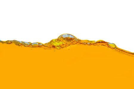 Close-up of orange juice with bright bubbles For health and natural wavesの写真素材