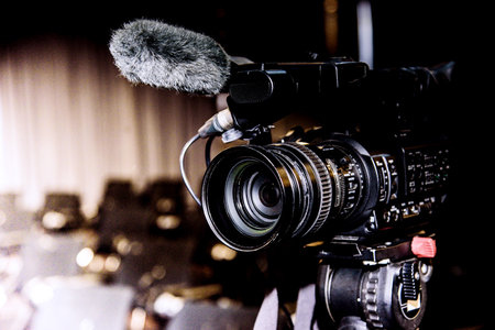 Cameraman with professional video camera on the stage in the theaterの写真素材