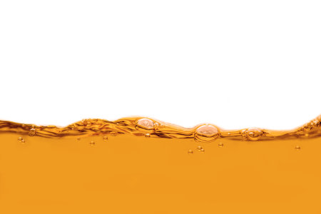 orange water splash isolated on white background with copy space for your textの写真素材