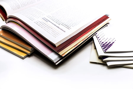 Stack of books on white background. Back to school. Copy space.の写真素材