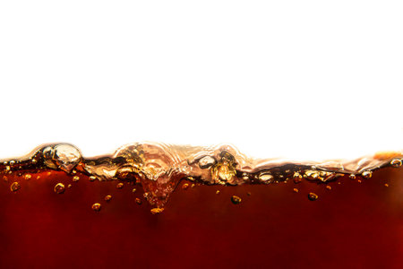 cola with bubbles isolated on a white background. close-upの写真素材