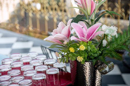 Wedding table decoration with pink lily flowers, stock photoの写真素材