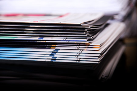 Close up of stack of documents on office desk. Selective focus.の写真素材