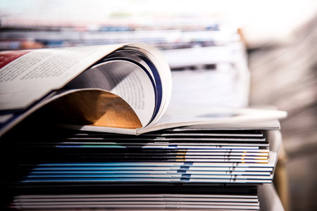 Pile of magazines on a shelf in a library. Selective focus.の写真素材
