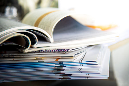 Stack of books on the table. Shallow depth of field.
