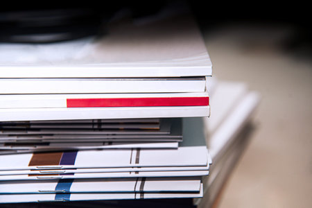 Stack of business documents on desk in office. Selective focus.