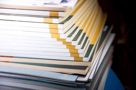 Stack of hardcover books on the table. Selective focus.