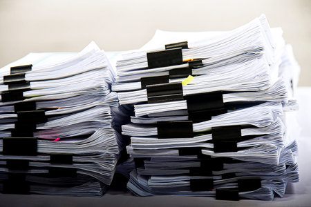 Pile of unfinished documents on office desk, Stack of business paper