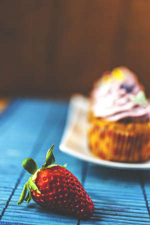 strawberry muffin with single strawberryの写真素材