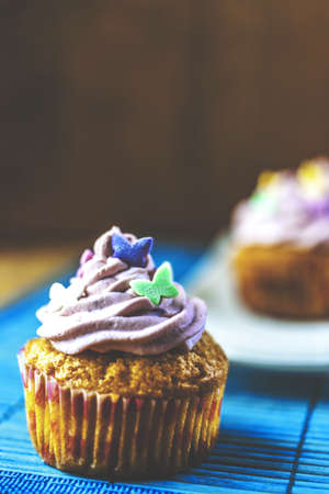 Pink muffins closeup at thee blue matの写真素材