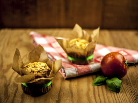 cheese muffin, couple of tomatoes and fresh basil leavesの写真素材