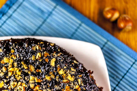 chockolate cake at the blue mat and white plateの写真素材