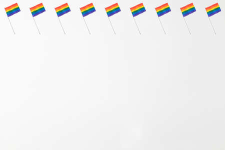 Lgtbi community rainbow flags pattern with hard shadow on top line on white background. Pride day conceptの写真素材