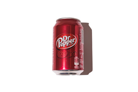 Dr. Pepper can with hard shadow on white background.