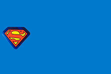 DC comics Superman superhero logo, on the left side, on blue background. Concept of superheroes, comics, logo, brand, business and universeのeditorial素材