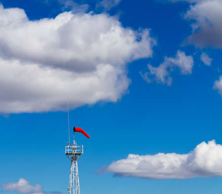 Bright Windsock Against a Vivid Blue Skyの写真素材