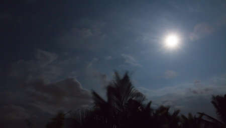 Beautiful full moon shines brightly over Hawaii.の写真素材