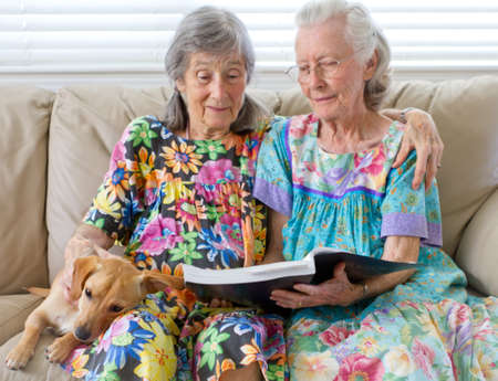 Two Elderly Ladies Reading A Bookの写真素材