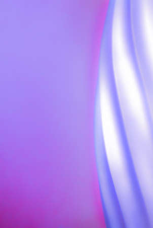 Abstract of a spiral border against a violet purple background  Design draws the eye in while the purple provides lots of room for copy space の写真素材