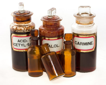 Five old fashioned chemical bottles, isolated on white