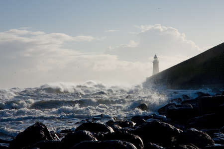 Tynemouth Pier in stormy winter weather, Englandの写真素材