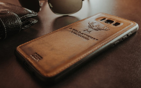 leather phone cover with random stuff