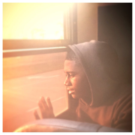 Boy gazing into the sunset