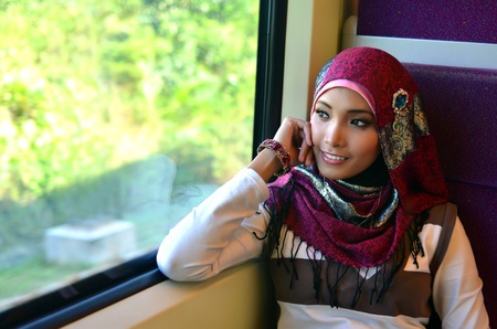 young pretty Asian muslim business woman in head scarf smileの写真素材
