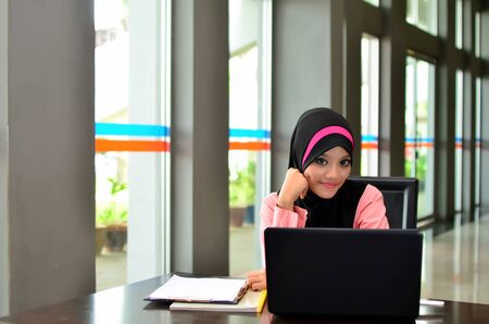 young muslim woman in head scarf surf internet の写真素材