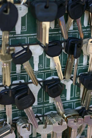 Uncut keys on a green boardの写真素材