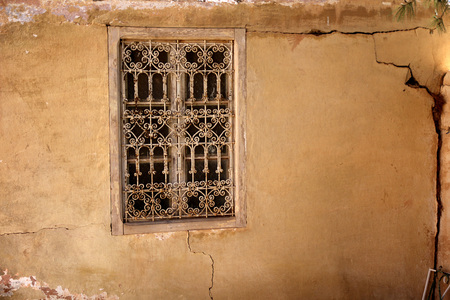 Window on aged building facade with ancient look that are stil in function.の写真素材