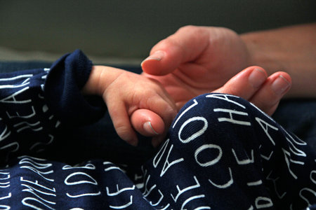 Newborn baby body parts and hand details