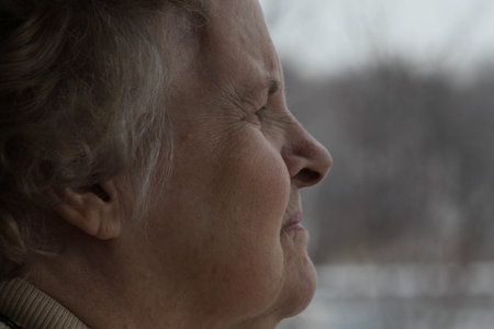 Elderly woman living her solitude and confinement