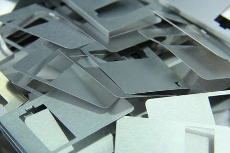 Aluminium parts from old disks to be recycled for background use.の写真素材