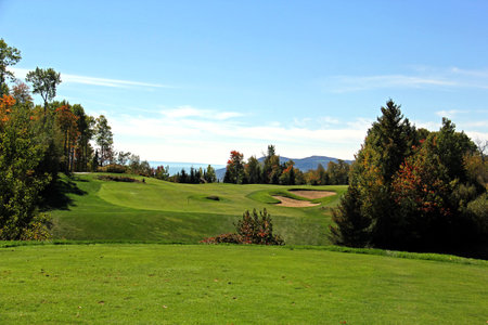 Scenic golf holes in the fall season with panoramic viewの写真素材