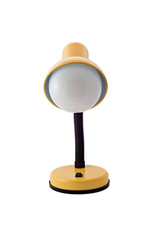Yellow luminescent desk lamp on white backgroundの写真素材